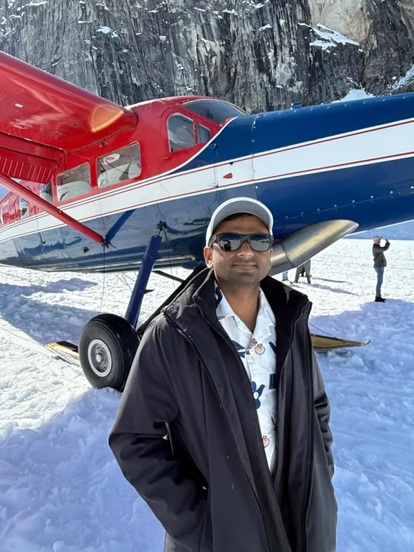 By the plane on the glacier