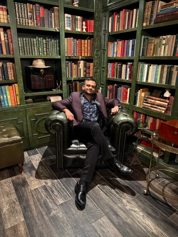 A chair by the bookshelves